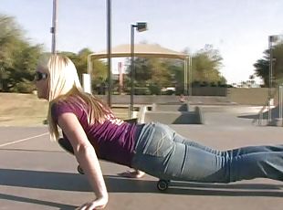 Affectionate blonde in jeans skating lovely in reality shoot outdoor