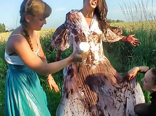 Girls cover the pretty bride in dirty mud and strip her