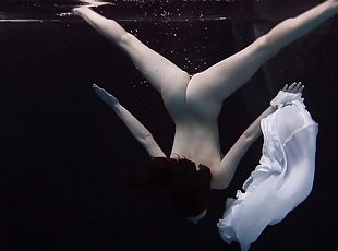 Andrejka slowly takes down her skirt while diving in the pool