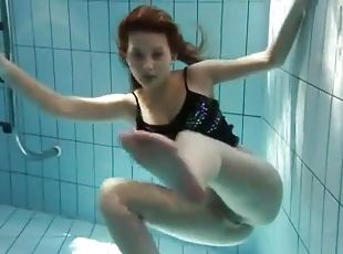 Sheer pantyhose are all wet on girl in pool