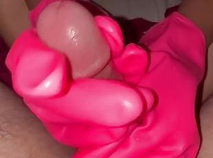 Handjob with pink rubber gloves with feet teasing dick