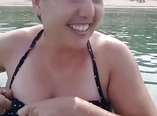Showing my big tits on the public beach