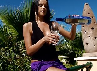 Sizzling brunette masturbates outdoors after drinking wine