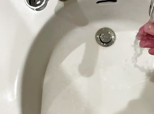 Peeing on bathroom sink
