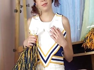 Pigtaield cheerleader sticks pom pom handle inside her twat