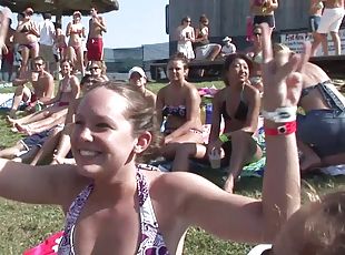 Outdoor reality clip with chicks wearing bikinis having fun at a party