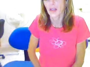 Blond milf wearing glasses masturbates her pussy in webcam solo clip