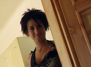 A cute girl with short hair jerks a guy off and makes him cum