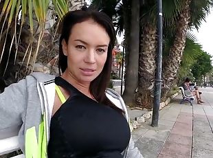 Franceska jaimes in a leggings posing on the bench in public