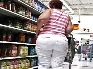 Chubby big-assed woman gets caught on a voyeur's cam in a supermarket