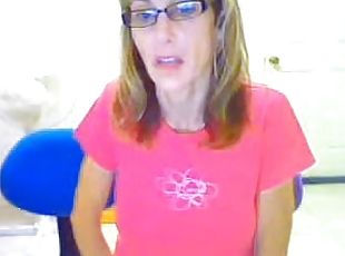 Blond milf wearing glasses masturbates her pussy in webcam solo clip