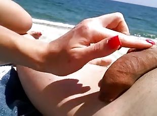 Girl trying to get boner on beach