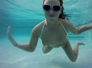 Immaculate solo model in a bikini goes for a swim in the pool