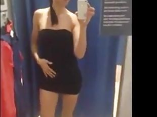 Girl with lovely slim body teasing in fitting room