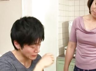 Japanese mature Chieko Oomura drops on her knees to pleasure