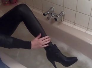 Sexy tight pants ankle boots and heels in bath