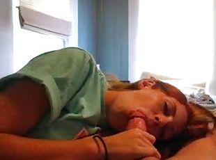 Cute young redhead sucks on big cock