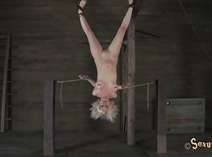 Blonde called Cherry tortured while hanging upside down in the dungeon