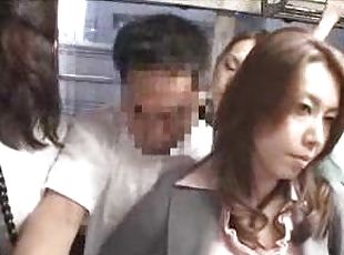 Asian babe strokes his cock on a public bus