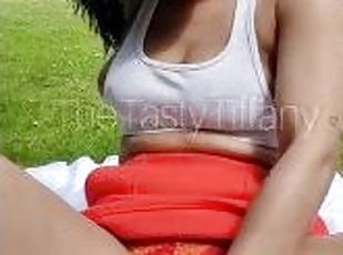 British mixed girl plays with her pussy in public park