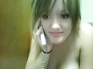 Chubby girl touches her tits while speaking on the phone