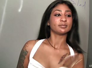 Tattooed ebony places her ass strategic for a drilling by a giant pecker in the glory hole
