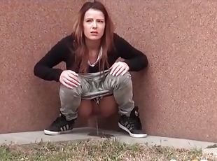 Cute brunette caught going pee outdoors