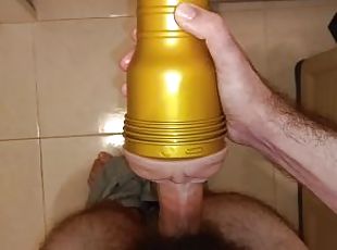 Hairy young man fucks the Fleshlight in the bedroom