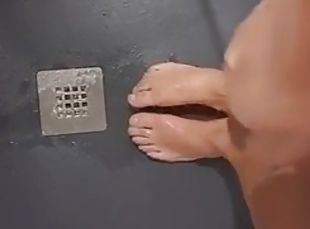 I masturbate in the shower, feeling hot piss peeing on my feet