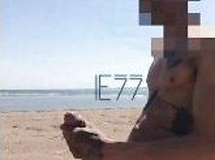 Playing with my big cock on the public beach