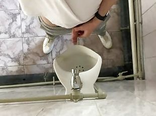 How guys pee in a urinal?